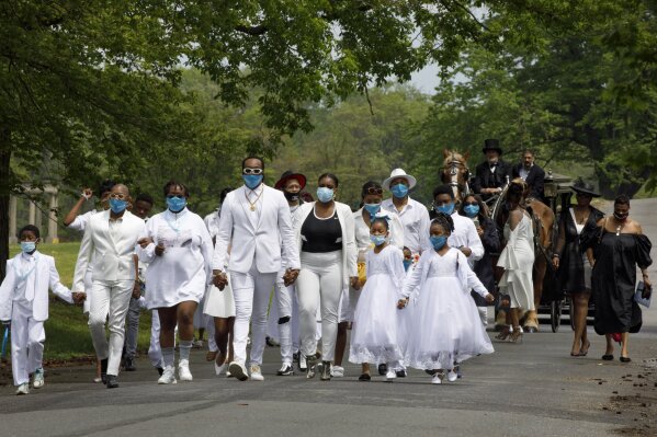 Funeral delayed tiaras white outfits turquoise face masks AP News